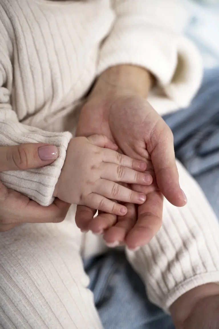 Assisted Hatching Success - A baby's tiny hand cradled within a parent's palm, symbolizing the hope and joy of successful IVF treatment at Dream IVF Cyprus.