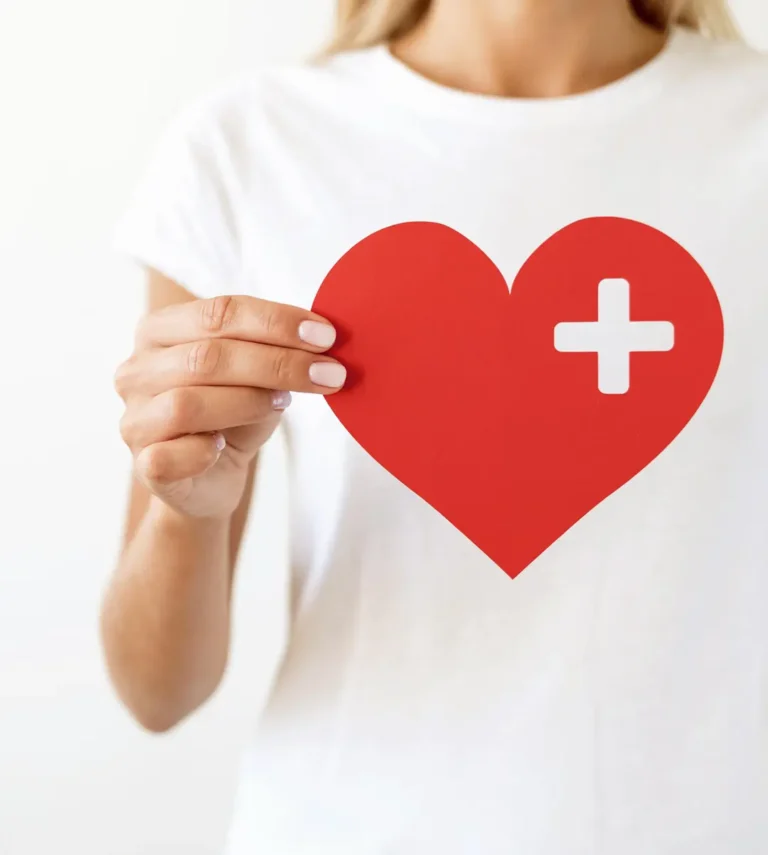 Woman holding a heart-shaped fertility symbol representing fertility preservation options for cancer patients at Dream IVF Cyprus