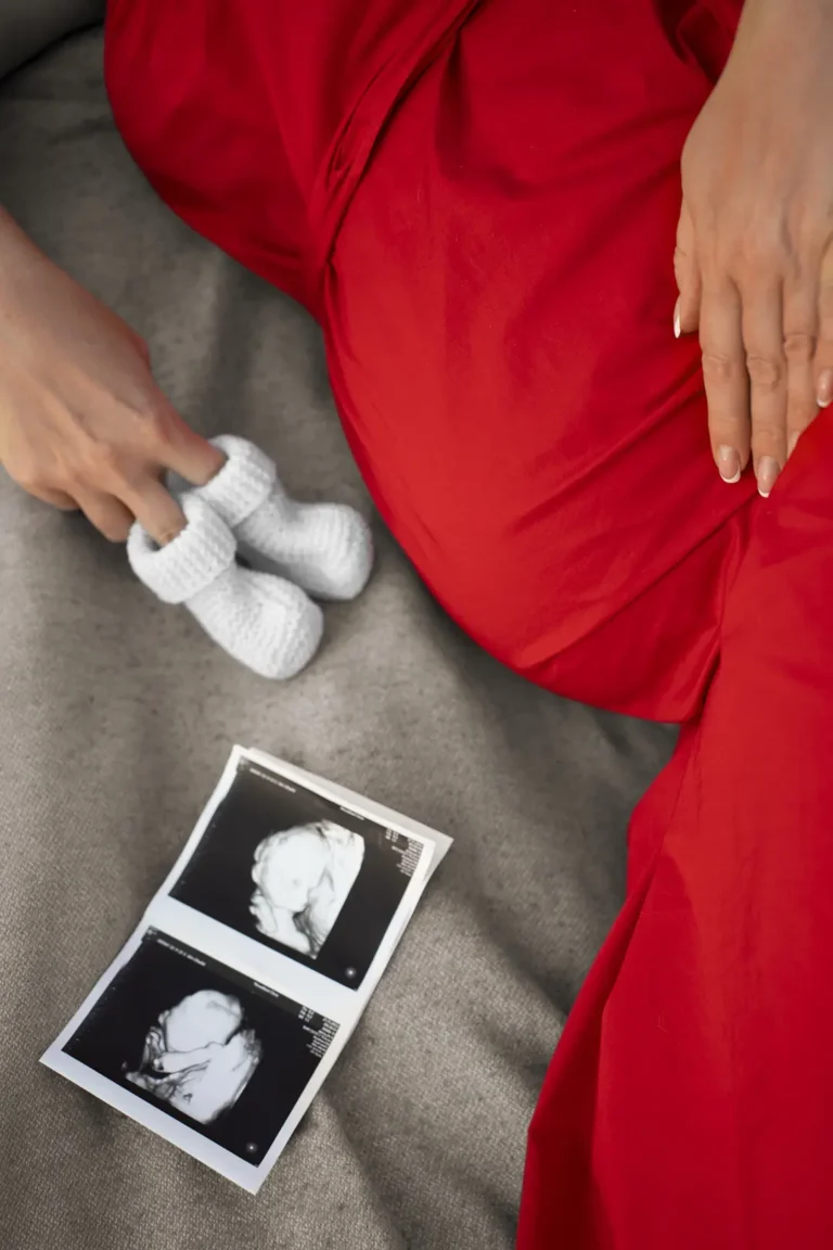 Pregnant woman enjoying serene outdoor time, connecting with nature during pregnancy - Dream IVF Cyprus, Nurturing Motherhood with Nature